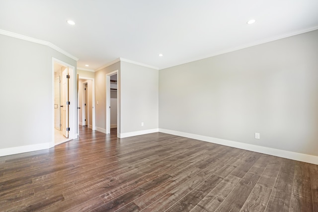 spare room with crown molding, recessed lighting, baseboards, and dark wood finished floors