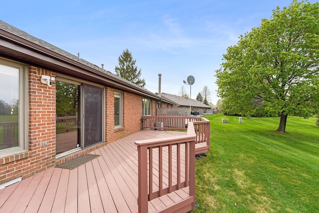 wooden terrace with a yard