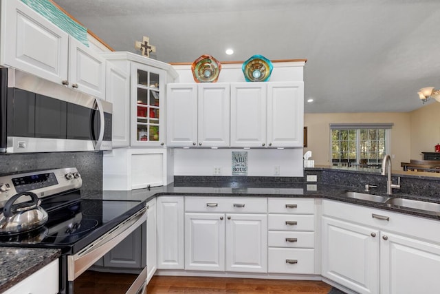 19905 Maple Ln, Howard City, MI 49329 - kitchen with a sink, stainless steel appliances, and white cabinetry
