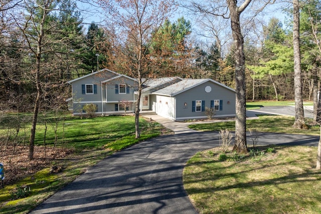 19905 Maple Ln, Howard City, MI 49329 - split level home featuring driveway and a front lawn