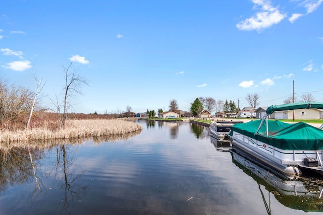 dock area with a water view and a residential view