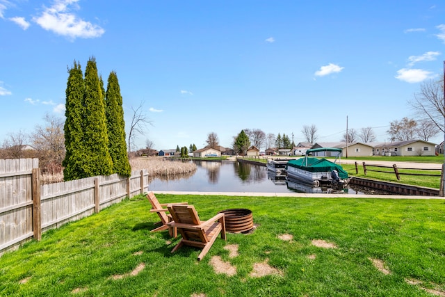 view of yard with a water view and a residential view
