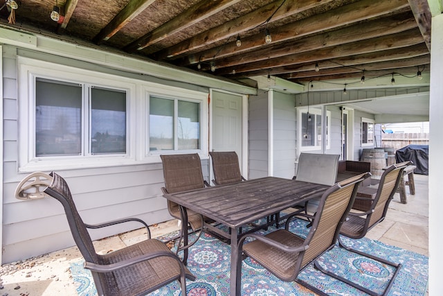view of patio with outdoor dining area and area for grilling