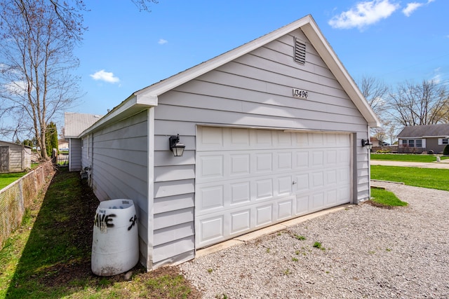 detached garage with fence