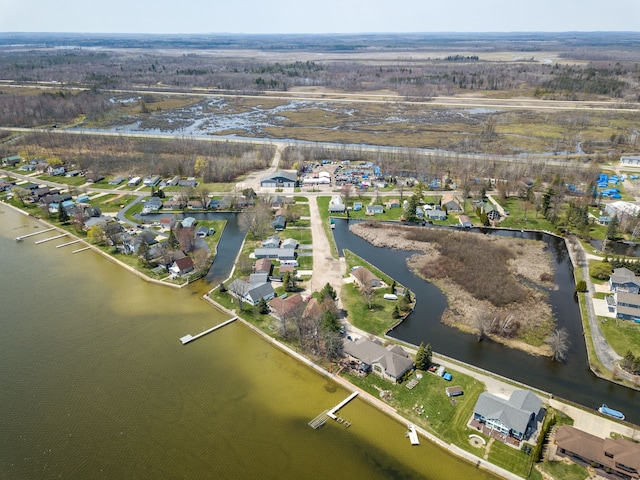 view of property location with a large body of water and nearby suburban area