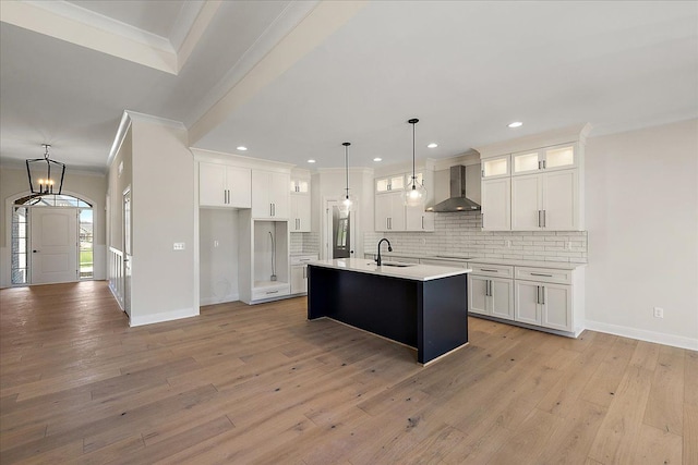 720 Marlayna Dr, Oxford, MI 48371 - kitchen with wall chimney range hood, ornamental molding, a sink, and white cabinets