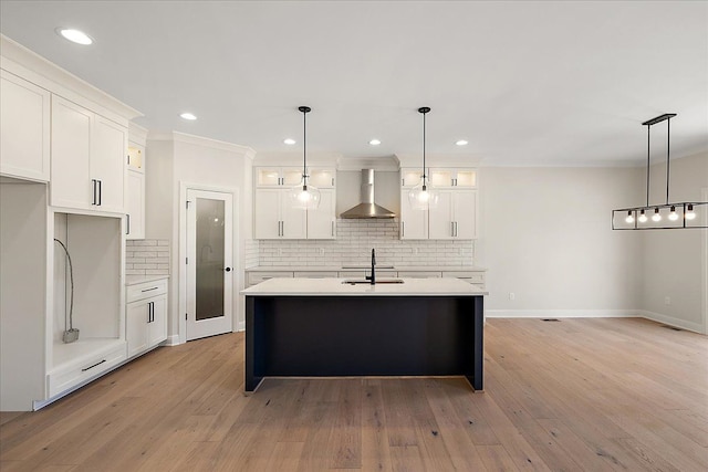 720 Marlayna Dr, Oxford, MI 48371 - kitchen with wall chimney range hood, white cabinetry, decorative backsplash, and light countertops