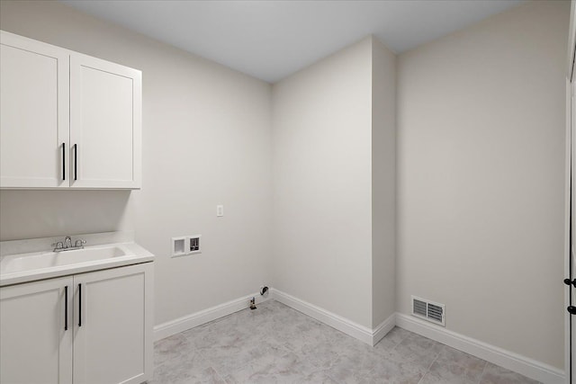 720 Marlayna Dr, Oxford, MI 48371 - clothes washing area featuring a sink, baseboards, hookup for a washing machine, and visible vents