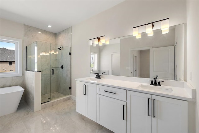 720 Marlayna Dr, Oxford, MI 48371 - bathroom with double vanity, marble finish floor, a soaking tub, a sink, and a shower stall