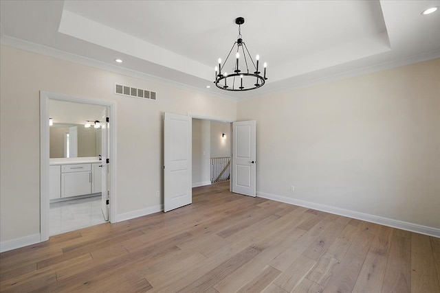 720 Marlayna Dr, Oxford, MI 48371 - unfurnished dining area with visible vents, an inviting chandelier, recessed lighting, a raised ceiling, and light wood finished floors