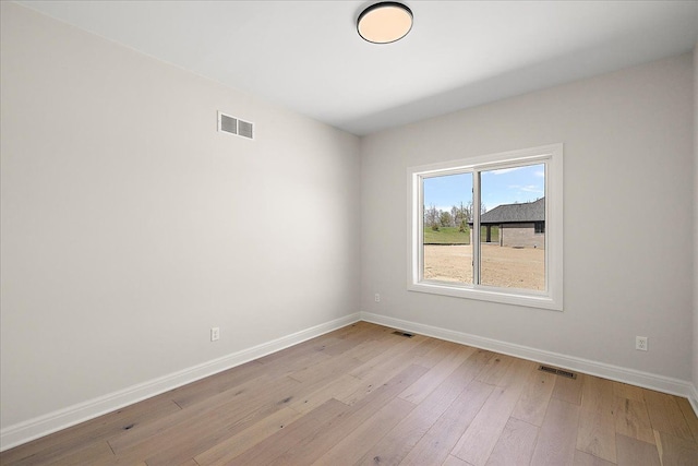 720 Marlayna Dr, Oxford, MI 48371 - empty room with baseboards, visible vents, and light wood-style floors