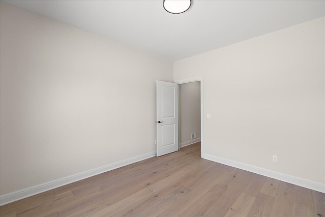 720 Marlayna Dr, Oxford, MI 48371 - spare room featuring baseboards and light wood finished floors