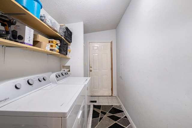 8239 Vanadia Dr, Mount Morris, MI 48458 - laundry room with laundry area, a textured ceiling, baseboards, light tile patterned floors, and washer and clothes dryer