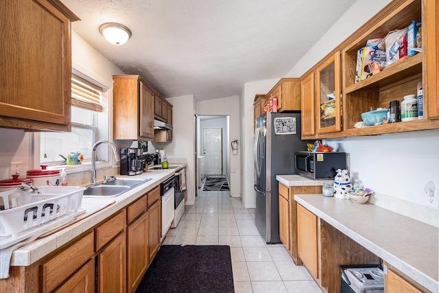 8239 Vanadia Dr, Mount Morris, MI 48458 - kitchen featuring a sink, appliances with stainless steel finishes, light tile patterned floors, and brown cabinets