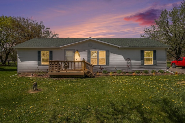 8239 Vanadia Dr, Mount Morris, MI 48458 - back of property featuring a shingled roof and a yard