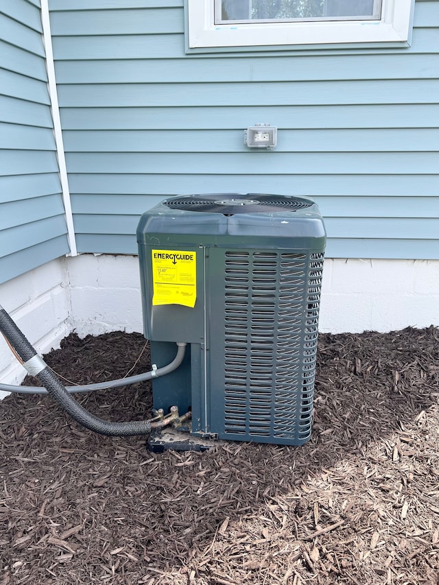exterior details featuring central AC