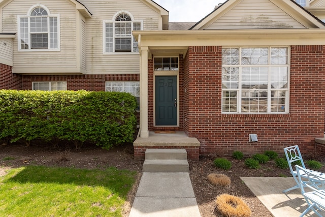entrance to property with brick siding