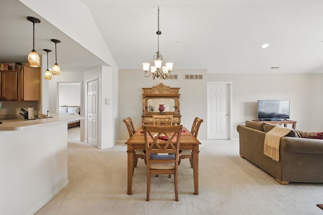 dining area featuring a notable chandelier, visible vents, light carpet, and baseboards