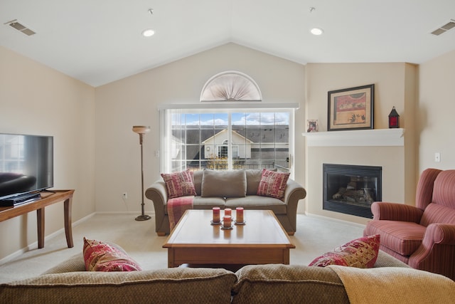 living area with baseboards, visible vents, and light colored carpet