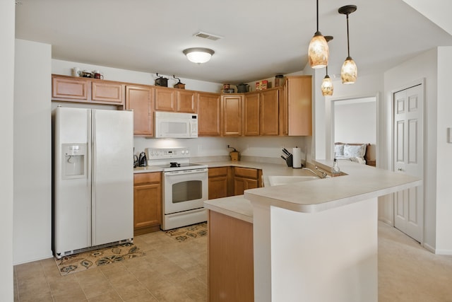 kitchen with visible vents, a peninsula, white appliances, light countertops, and a sink
