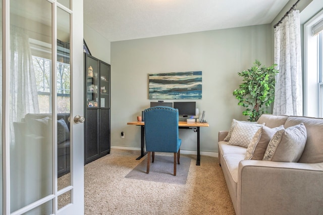 1813 Garfield St, Howell, MI 48855 - office area with light carpet, baseboards, and french doors