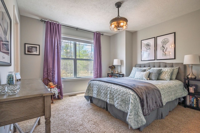 1813 Garfield St, Howell, MI 48855 - carpeted bedroom with a textured ceiling and baseboards