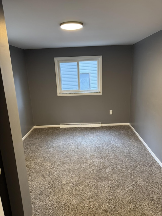 8854 E Pickard Rd, Mount Pleasant, MI 48858 - carpeted empty room featuring baseboards and a baseboard radiator