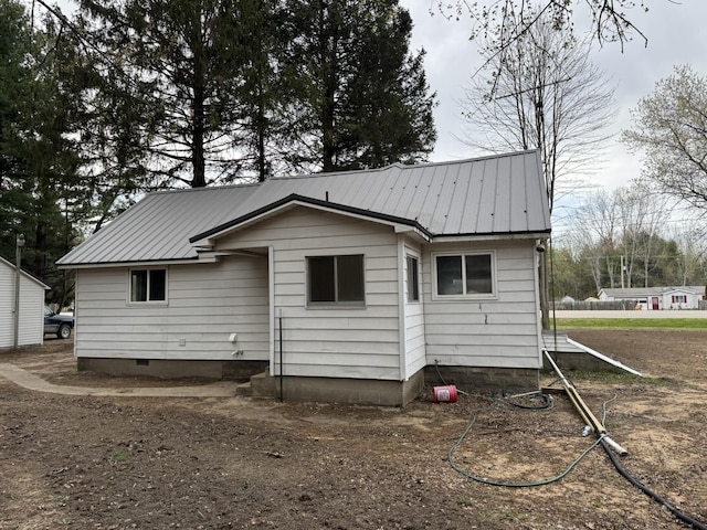 8854 E Pickard Rd, Mount Pleasant, MI 48858 - back of house featuring metal roof