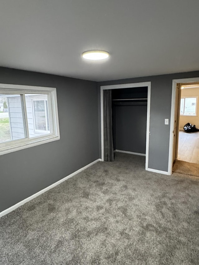 8854 E Pickard Rd, Mount Pleasant, MI 48858 - unfurnished bedroom featuring carpet flooring, baseboards, and a closet