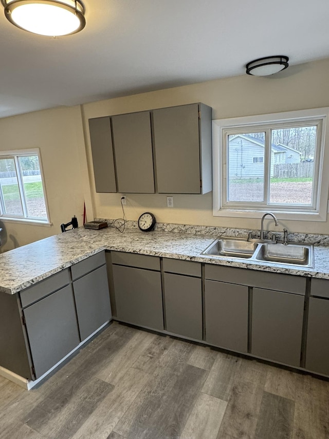 8854 E Pickard Rd, Mount Pleasant, MI 48858 - kitchen featuring a sink and gray cabinets