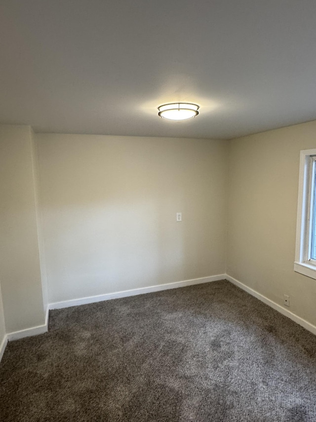 8854 E Pickard Rd, Mount Pleasant, MI 48858 - empty room with carpet floors and baseboards