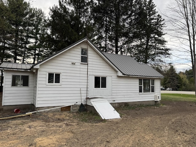 8854 E Pickard Rd, Mount Pleasant, MI 48858 - back of property featuring metal roof