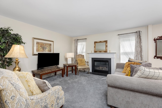 living room with a fireplace with flush hearth and carpet flooring