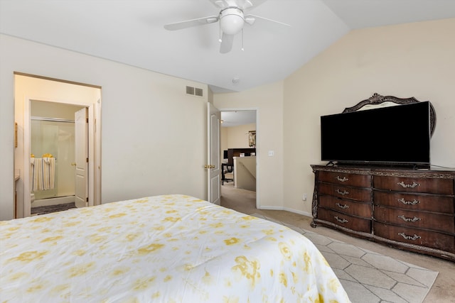 bedroom with ceiling fan, visible vents, vaulted ceiling, carpet floors, and ensuite bath