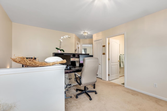 carpeted office with baseboards