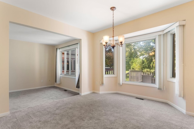 6360 Robison Ln, Saline, MI 48176 - carpeted empty room with baseboards, a chandelier, and visible vents