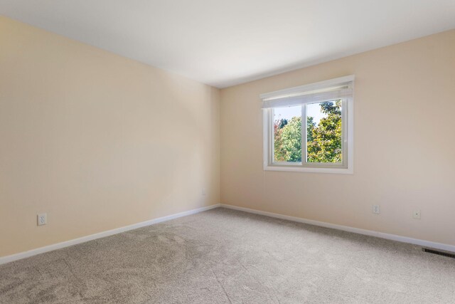 6360 Robison Ln, Saline, MI 48176 - unfurnished room featuring visible vents, baseboards, and carpet floors