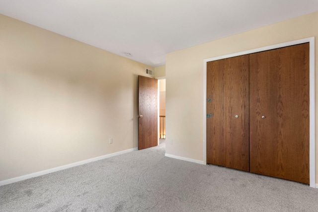 6360 Robison Ln, Saline, MI 48176 - unfurnished bedroom with carpet floors, baseboards, visible vents, and a closet