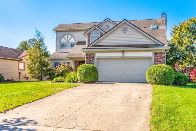 6360 Robison Ln, Saline, MI 48176 - traditional-style home with concrete driveway, brick siding, a front lawn, and a garage