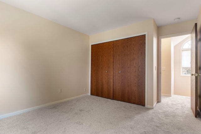 6360 Robison Ln, Saline, MI 48176 - unfurnished bedroom featuring carpet floors, baseboards, and a closet