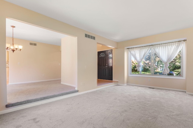 6360 Robison Ln, Saline, MI 48176 - spare room featuring visible vents, carpet, and a chandelier