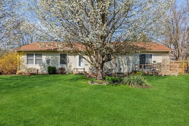3833 Green Acre Dr, Saint Joseph, MI 49085 - back of house with a lawn and fence