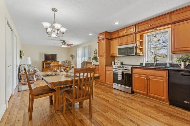 3833 Green Acre Dr, Saint Joseph, MI 49085 - kitchen featuring recessed lighting, appliances with stainless steel finishes, a sink, and light wood finished floors