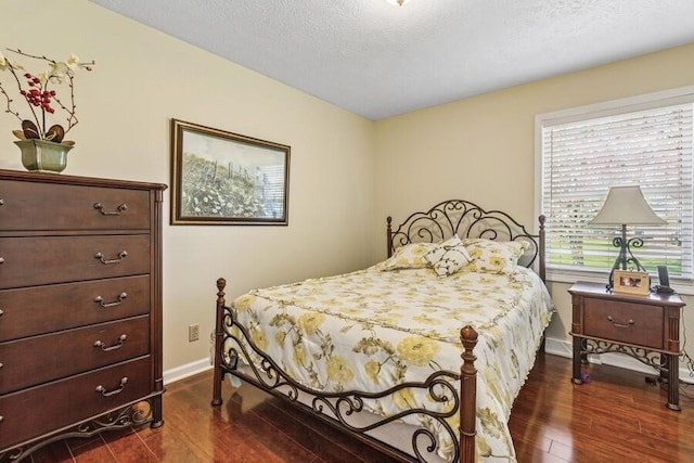 3833 Green Acre Dr, Saint Joseph, MI 49085 - bedroom with dark wood-type flooring and baseboards
