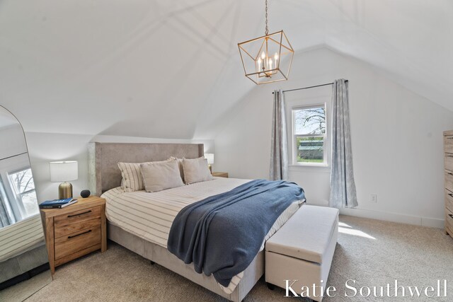 bedroom with a notable chandelier, light colored carpet, and lofted ceiling