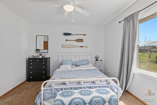 bedroom with carpet floors, baseboards, and ceiling fan