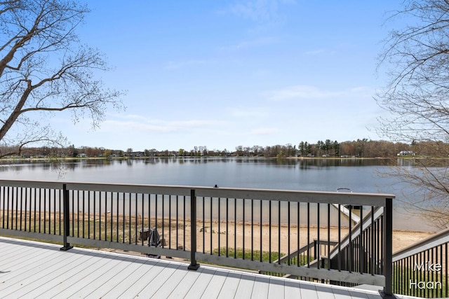 deck featuring a water view