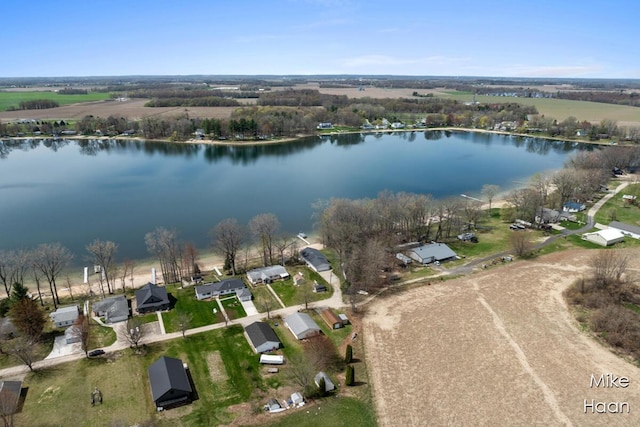 birds eye view of property with a water view and a residential view