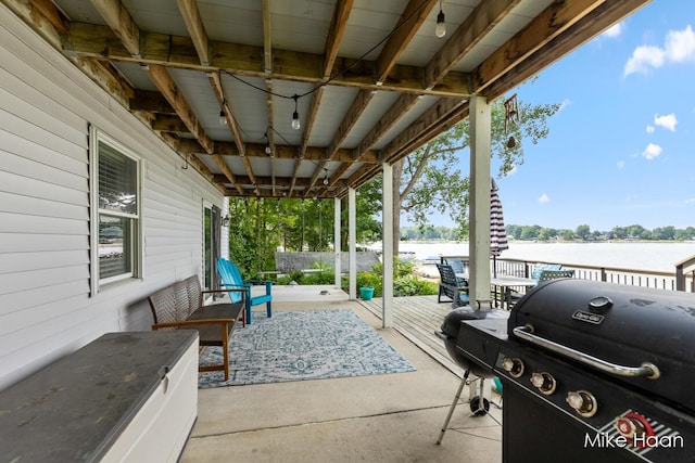 13545 Armitage Dr, Coral, MI 49322 - view of patio / terrace with a grill and a water view