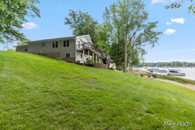 13545 Armitage Dr, Coral, MI 49322 - view of home's exterior with stairs, a yard, and a deck with water view